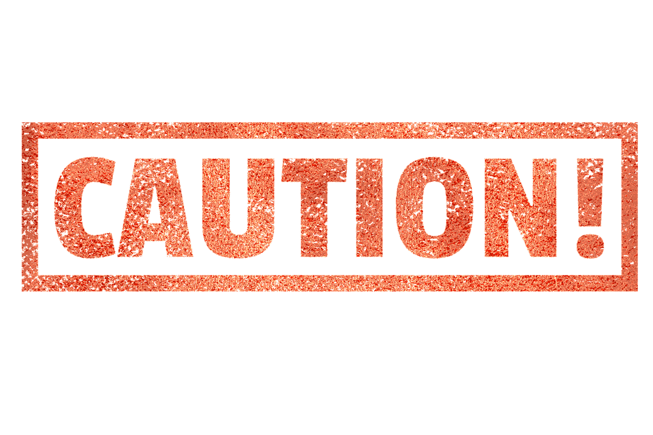 Warning label symbolizing caution when vetting freelancers online