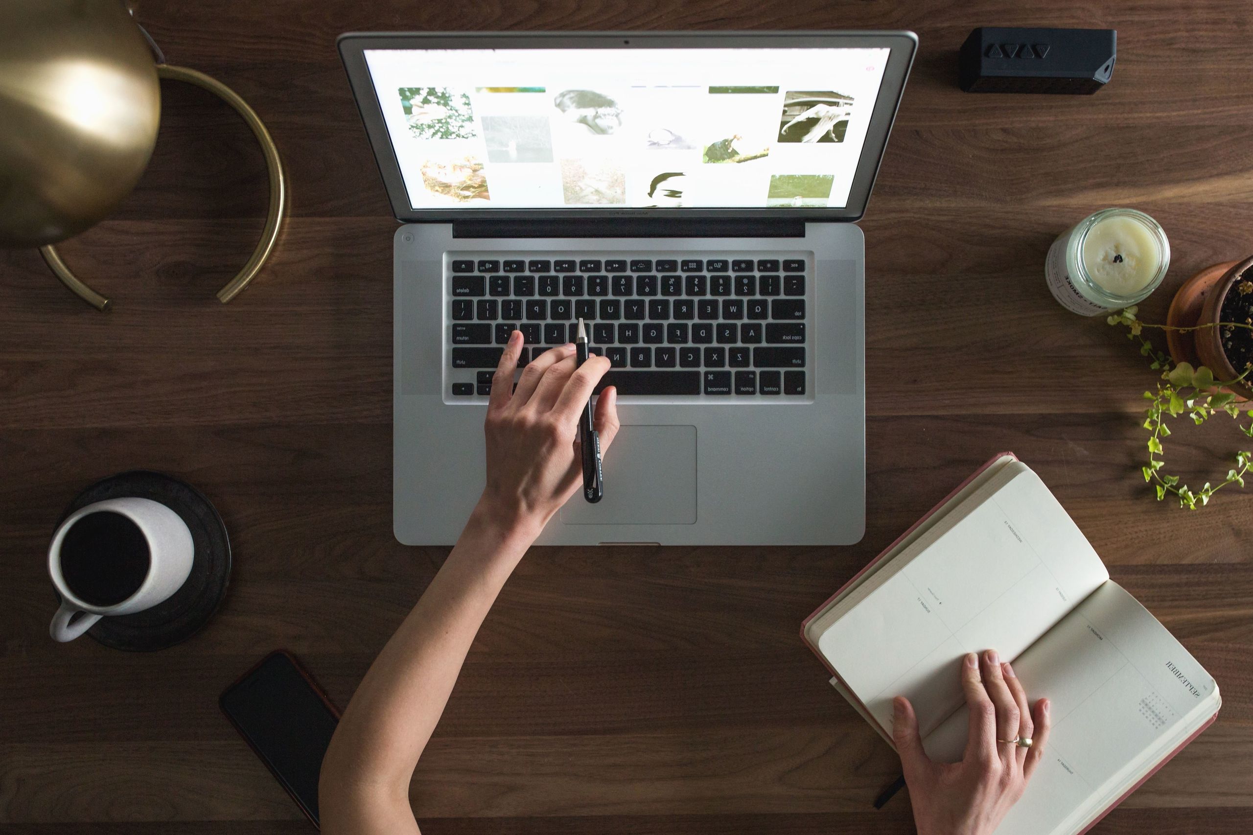 Person researching outsourcing options on a laptop
